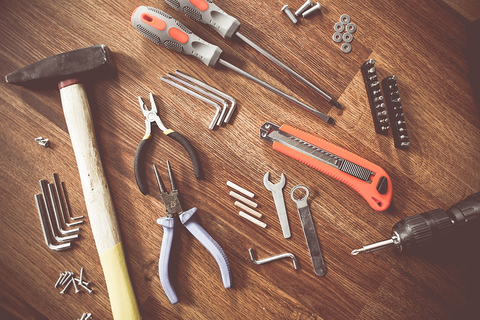 assorted carpentry tools on brown wooden surface HD wallpaper