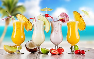 four varieties of shakes with straw and mini umbrellas HD wallpaper