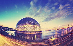 timelapse photography of dome building with body of water
