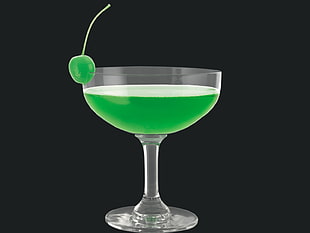 green cocktail on glass