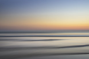 calm body of water wallpaper