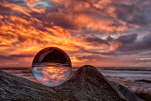 clear glass ball on top of gray boulder, porth HD wallpaper