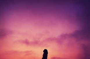 silhouette of woman with scarlet skies HD wallpaper