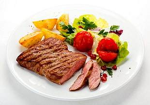 steak on white ceramic plate