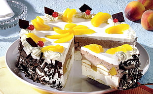 slice of creamed chocolate cake with toppings