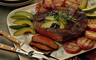 beef steak with avocado and onions