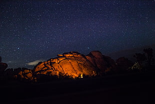 brown stone mountain, campfire, fire, stars, night sky HD wallpaper