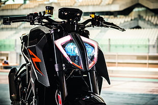 black and orange motard motorcycle