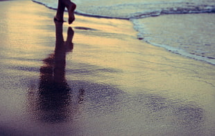 person walking beside seashore, nature, beach, water, feet