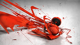red corded headphones splashed on white surface