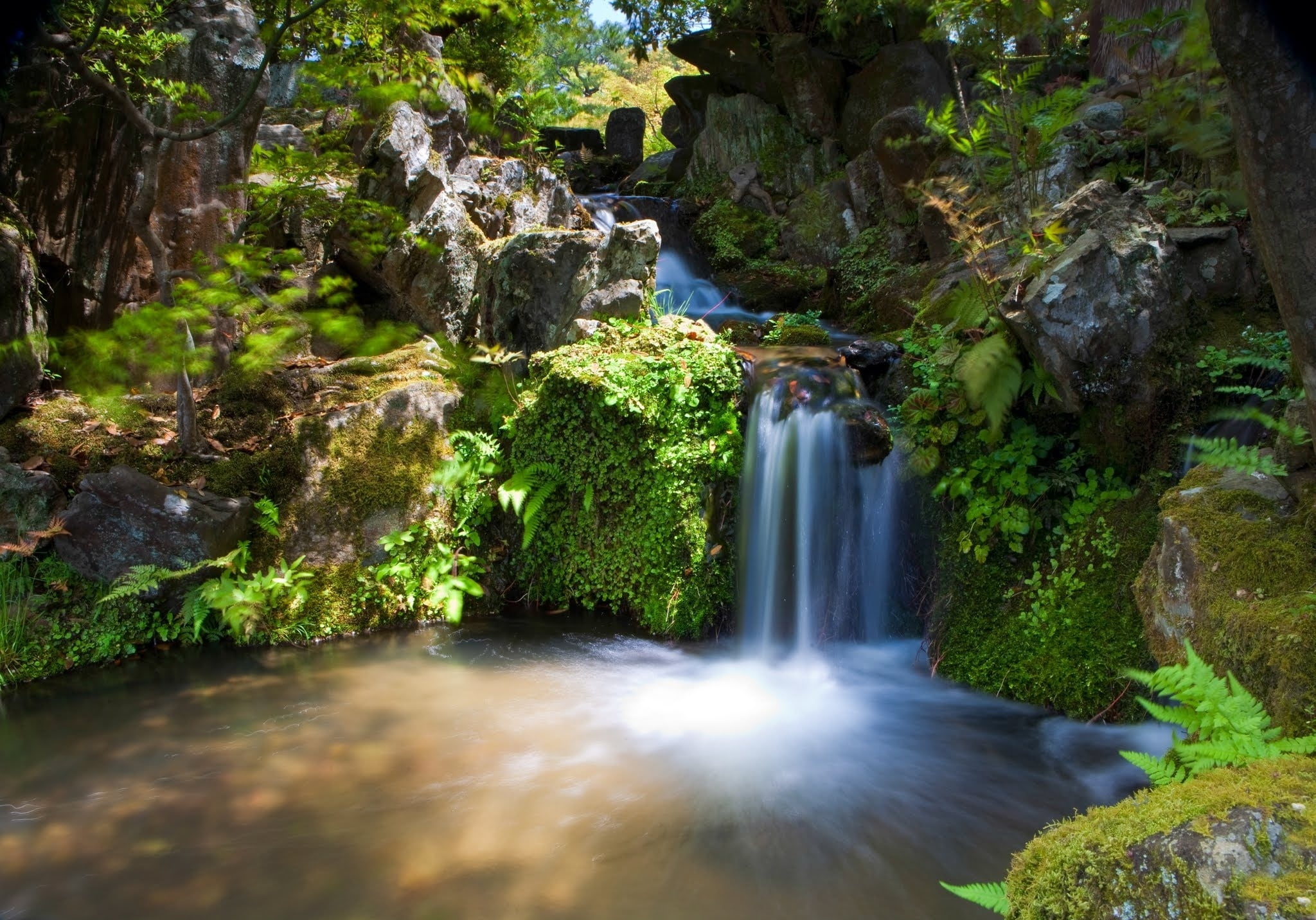 time lapsed photo of small water falls during daytime