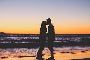 silhouette photo of man and woman