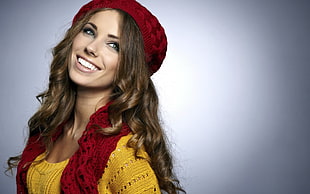 woman wearing red knit cap and red scarf