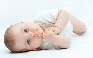 photo of baby in white shirt