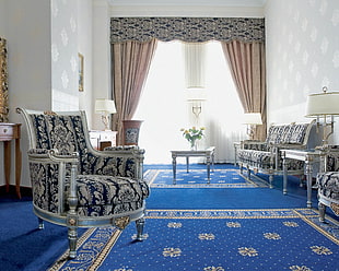 photo of blue, white, and gray living room set