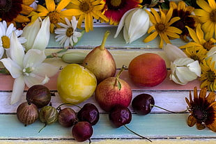 purple, yellow and red round fruits