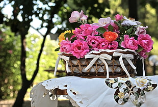 brown basket with pink and white Rose flowers