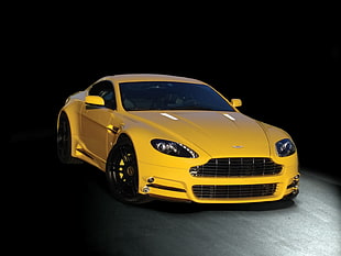 Yellow Bentley sports car parked on concrete flooring