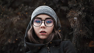 woman in black framed eyeglasses and black hooded jacket HD wallpaper