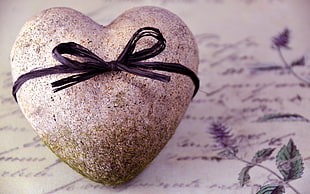 stone heart with black ribbon