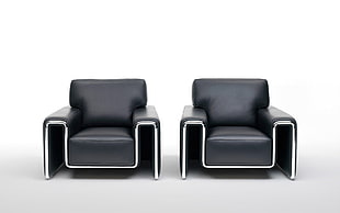 two black leather armchairs