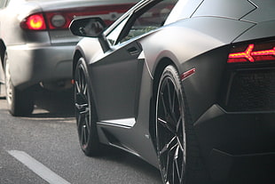 gray Lamborghini Aventador on black top road