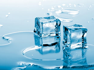 two ice cubes on blue surface HD wallpaper