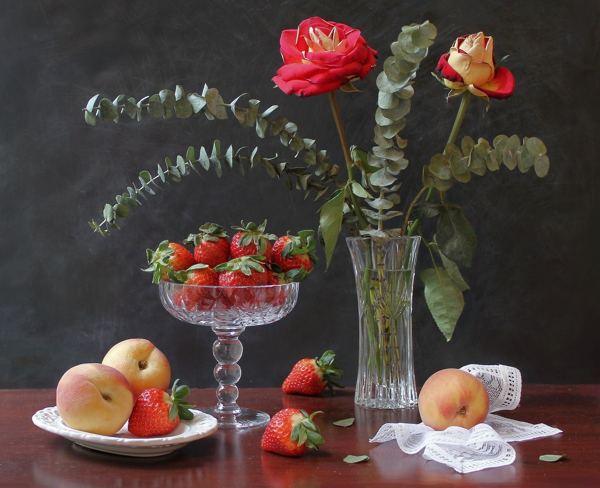 variety of fruits and plant with clear glass vases