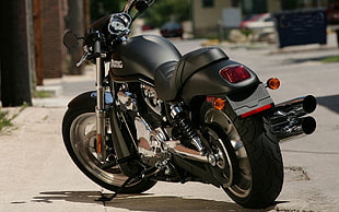 black cruiser motorcycle on road