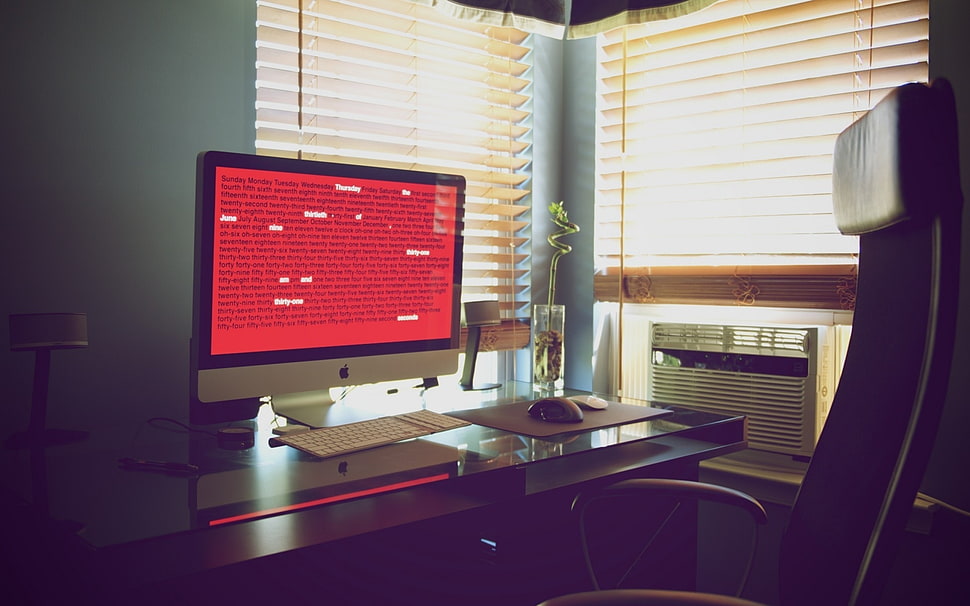 turned on silver iMac on table HD wallpaper