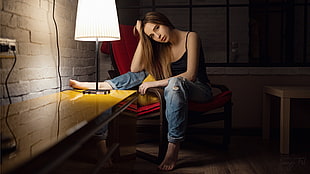 photo of woman in black camisole and blue jeans sitting on chair HD wallpaper