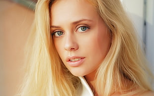 close up photo of woman's face with blonde hair