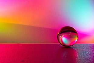 glass ball on table HD wallpaper