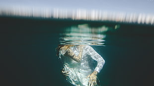 person underwater during daytime HD wallpaper