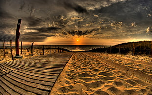 brown sand near seashore during dawn