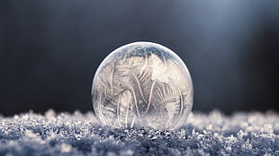 round clear crystal on ground photograph HD wallpaper