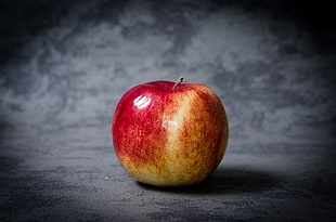 still life photography of apple fruit on black surface