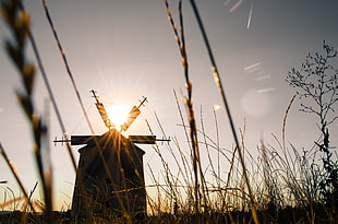 photo of a windmill over the sunset