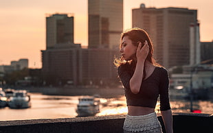woman holding her hair during golden hour photography