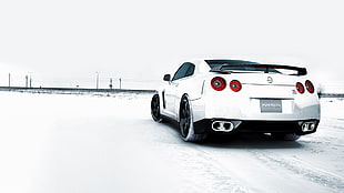 photo of white car during snow season