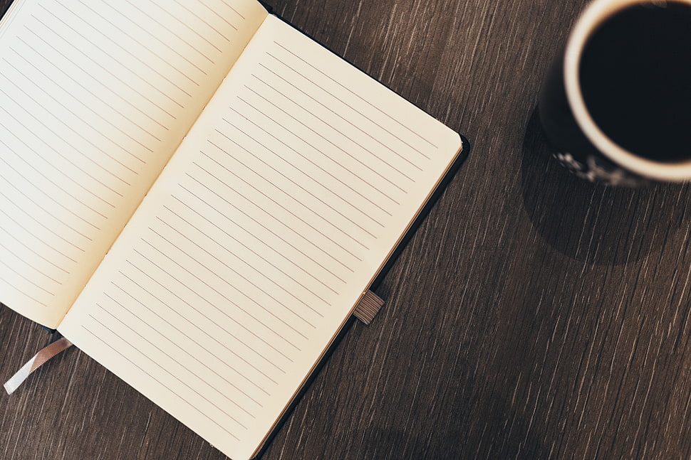 ceramic mug near book on table HD wallpaper