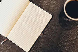 ceramic mug near book on table