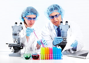 two scientist holding microscope and test tube HD wallpaper