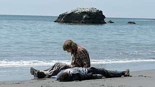 two people on beach shore during daytime