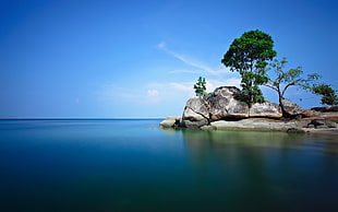 rock formation and blue sea photo