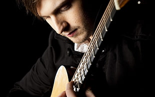 man wearing black top playing string instrument HD wallpaper