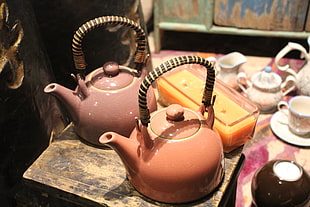 two ceramic tea pots on tray