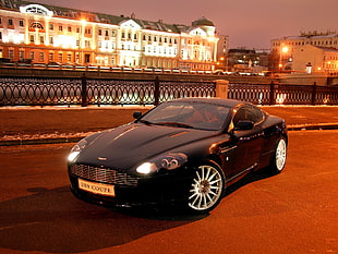 photography of black Aston Martin DB9
