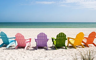 six assorted colored of lounge wooden chairs