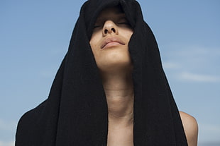 woman with black towel on her head